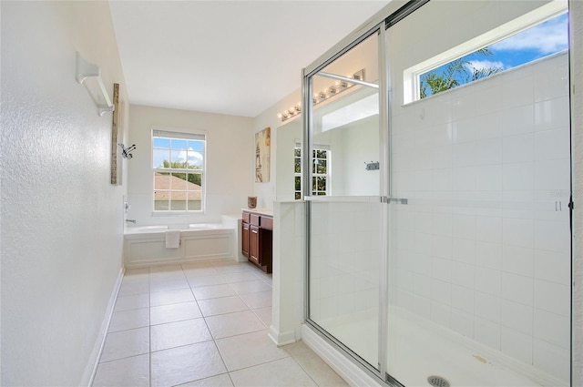 2669 Manesty Ln, Kissimmee, FL 34747 - full bath with a bath, vanity, a shower stall, and tile patterned floors