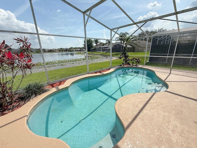 outdoor pool featuring a water view, a yard, a lanai, and a patio