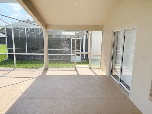 view of patio / terrace featuring glass enclosure