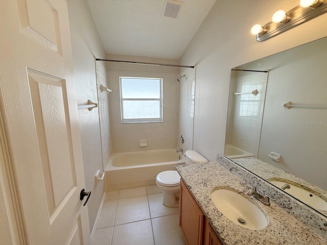 bathroom featuring washtub / shower combination, vanity, tile patterned flooring, and vaulted ceiling