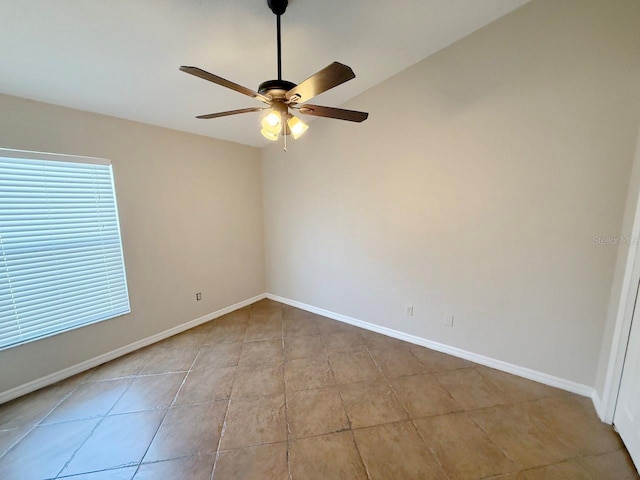 unfurnished room featuring a ceiling fan and tile patterned floors