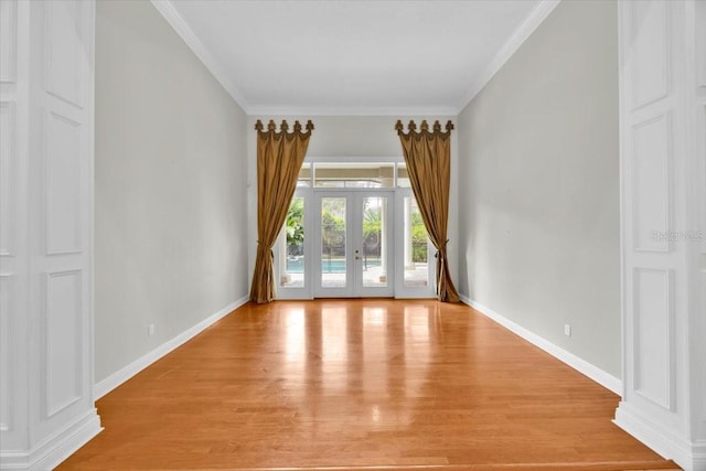 307 Running Wind Ln, Maitland, FL 32751 - spare room with french doors, light wood-style floors, and crown molding