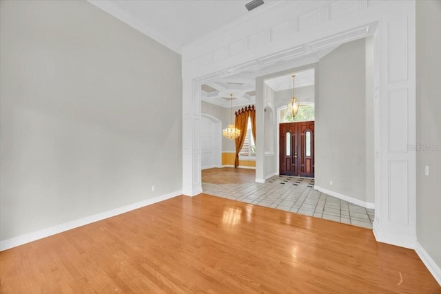 307 Running Wind Ln, Maitland, FL 32751 - foyer with wood finished floors, arched walkways, and a chandelier