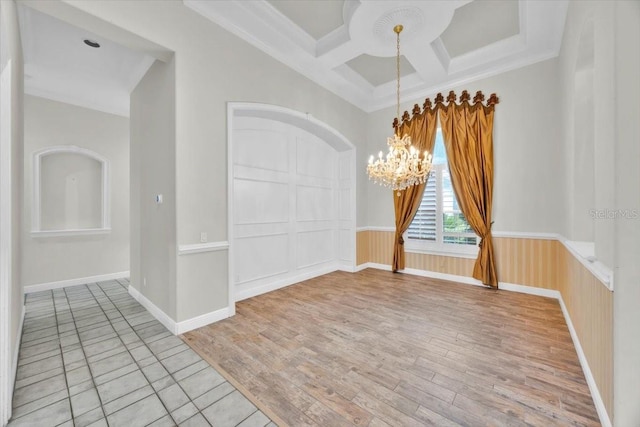 307 Running Wind Ln, Maitland, FL 32751 - spare room with a chandelier, light wood-style flooring, beam ceiling, coffered ceiling, and ornamental molding