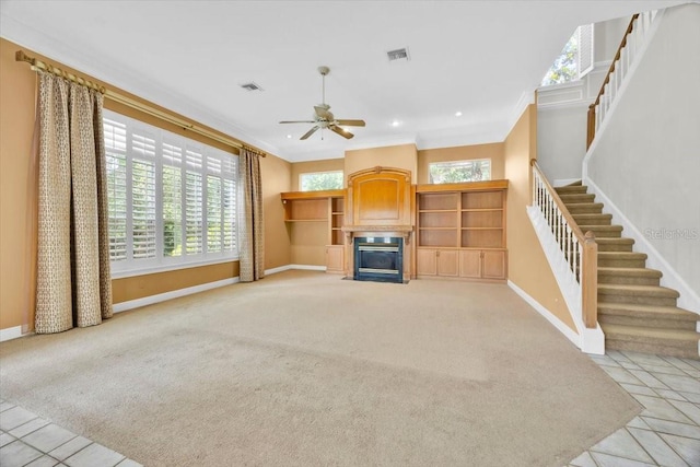 307 Running Wind Ln, Maitland, FL 32751 - unfurnished living room featuring a fireplace with flush hearth, stairs, ceiling fan, ornamental molding, and recessed lighting