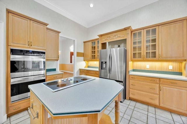 307 Running Wind Ln, Maitland, FL 32751 - kitchen with appliances with stainless steel finishes, light brown cabinetry, crown molding, and a kitchen island