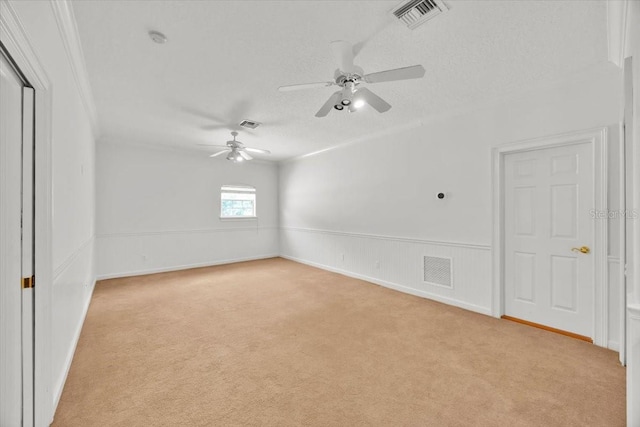 307 Running Wind Ln, Maitland, FL 32751 - unfurnished room with light colored carpet, a ceiling fan, ornamental molding, a smoke detector, and a wainscoted wall