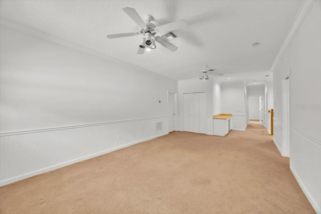 307 Running Wind Ln, Maitland, FL 32751 - spare room featuring light colored carpet, a ceiling fan, and ornamental molding