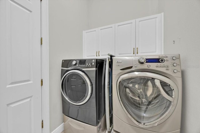 307 Running Wind Ln, Maitland, FL 32751 - laundry area featuring cabinet space and independent washer and dryer