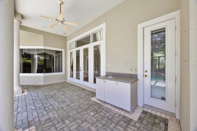 307 Running Wind Ln, Maitland, FL 32751 - unfurnished sunroom featuring french doors