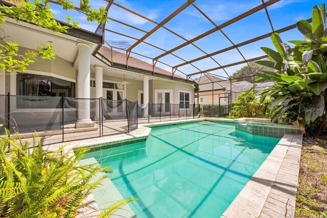 307 Running Wind Ln, Maitland, FL 32751 - view of pool featuring french doors, a patio, glass enclosure, a pool with connected hot tub, and a ceiling fan