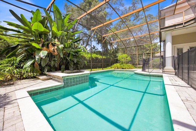 307 Running Wind Ln, Maitland, FL 32751 - view of pool featuring glass enclosure and a patio