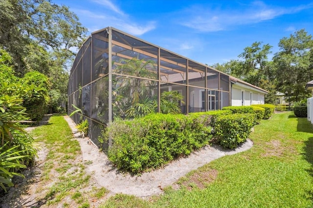 307 Running Wind Ln, Maitland, FL 32751 - rear view of property featuring a lawn and glass enclosure