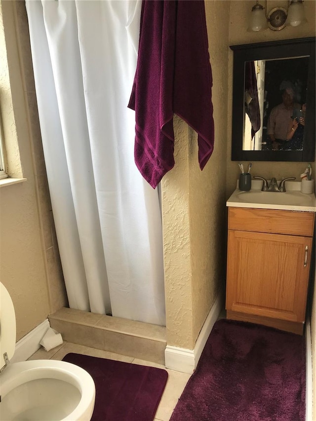 10 S Semoran Blvd S, Orlando, FL 32822 - full bath with vanity, a shower stall, and a textured wall