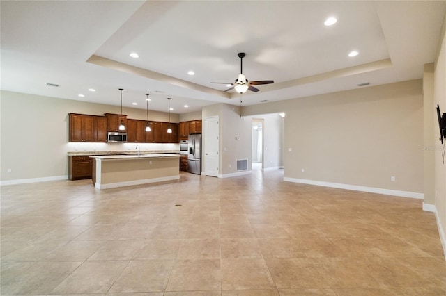 207 Spalding Way, Deland, FL 32724 - unfurnished living room featuring a raised ceiling, recessed lighting, ceiling fan, and light tile patterned flooring