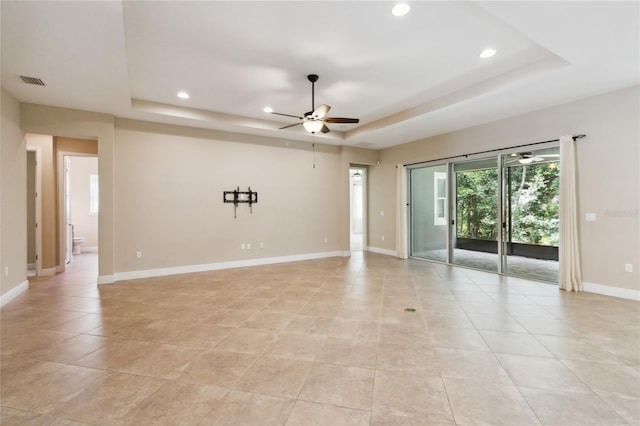 207 Spalding Way, Deland, FL 32724 - unfurnished room featuring a raised ceiling, a ceiling fan, recessed lighting, plenty of natural light, and light tile patterned flooring
