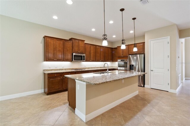 207 Spalding Way, Deland, FL 32724 - kitchen with stainless steel appliances, light stone countertops, recessed lighting, pendant lighting, and a kitchen island with sink