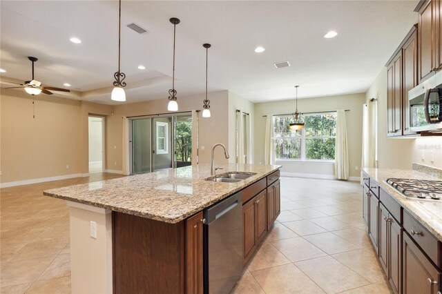 207 Spalding Way, Deland, FL 32724 - kitchen featuring appliances with stainless steel finishes, an island with sink, recessed lighting, a ceiling fan, and light tile patterned flooring