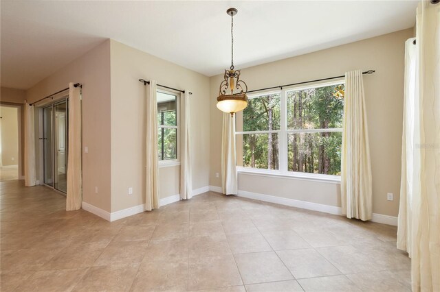 207 Spalding Way, Deland, FL 32724 - spare room with plenty of natural light and light tile patterned flooring