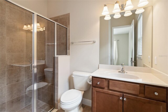 207 Spalding Way, Deland, FL 32724 - bathroom featuring vanity, a chandelier, and a shower stall