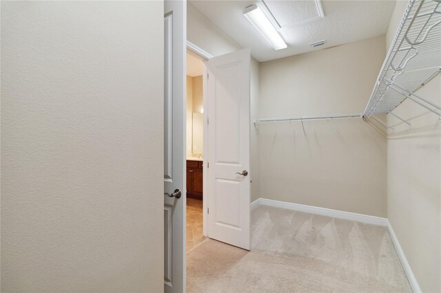 207 Spalding Way, Deland, FL 32724 - walk in closet featuring light colored carpet