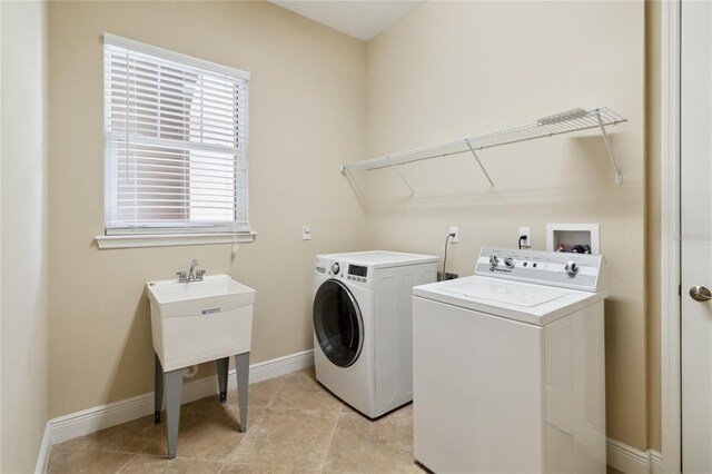 207 Spalding Way, Deland, FL 32724 - laundry room featuring washing machine and clothes dryer and light tile patterned floors