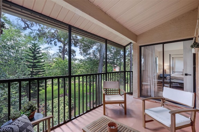 7742 Sugar Bend Dr Unit 7742, Orlando, FL 32819 - sunroom featuring lofted ceiling