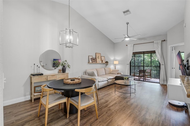 7742 Sugar Bend Dr Unit 7742, Orlando, FL 32819 - living room with high vaulted ceiling, dark wood finished floors, a ceiling fan, and a chandelier
