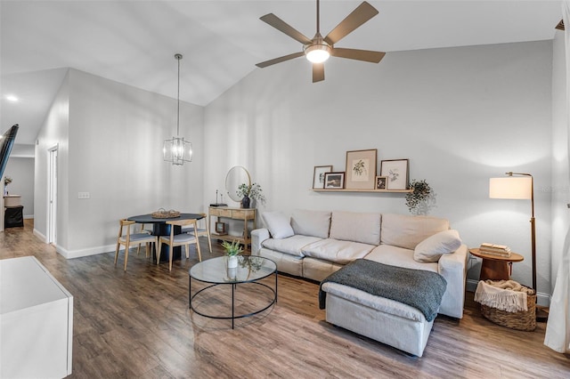 7742 Sugar Bend Dr Unit 7742, Orlando, FL 32819 - living area featuring a ceiling fan, wood finished floors, a chandelier, and vaulted ceiling