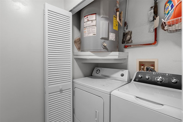 7742 Sugar Bend Dr Unit 7742, Orlando, FL 32819 - laundry room with water heater and separate washer and dryer