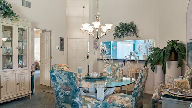 165 Durham Pl Unit 165, Longwood, FL 32779 - dining space with carpet, a chandelier, and a high ceiling