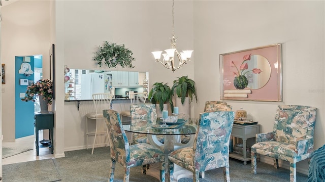165 Durham Pl Unit 165, Longwood, FL 32779 - dining room featuring a towering ceiling, a chandelier, and carpet