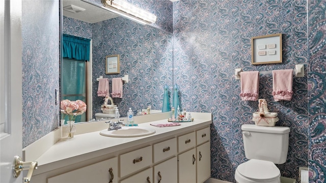 165 Durham Pl Unit 165, Longwood, FL 32779 - bathroom with vanity and wallpapered walls