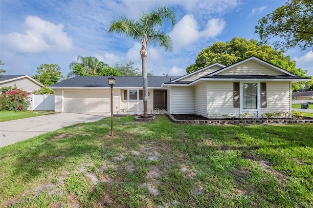 4800 Reginald Rd, Orlando, FL 32829 - ranch-style home featuring a garage and driveway
