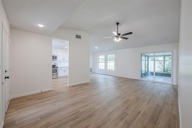 4800 Reginald Rd, Orlando, FL 32829 - unfurnished living room featuring vaulted ceiling, a ceiling fan, light wood finished floors, and recessed lighting