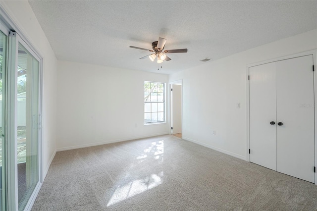 4800 Reginald Rd, Orlando, FL 32829 - unfurnished bedroom featuring carpet, a textured ceiling, and ceiling fan