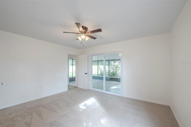 4800 Reginald Rd, Orlando, FL 32829 - spare room featuring a ceiling fan and light colored carpet