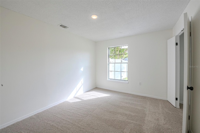 4800 Reginald Rd, Orlando, FL 32829 - unfurnished bedroom featuring carpet and a textured ceiling