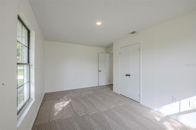 4800 Reginald Rd, Orlando, FL 32829 - empty room featuring light colored carpet and recessed lighting
