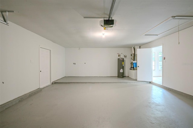 4800 Reginald Rd, Orlando, FL 32829 - garage featuring a garage door opener and water heater
