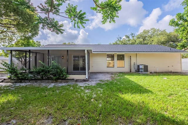 4800 Reginald Rd, Orlando, FL 32829 - back of property featuring a sunroom and a yard