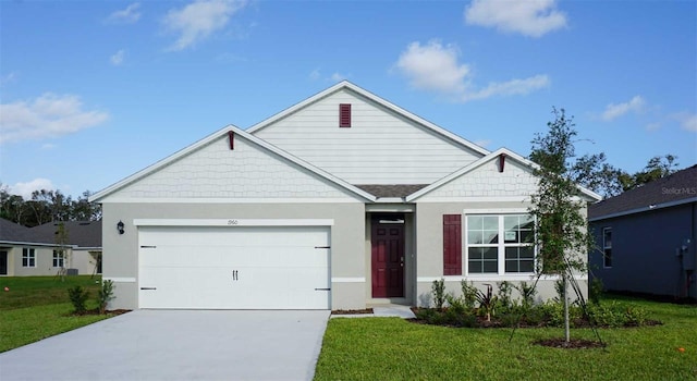 1902 Walnut Creek Dr, Kissimmee, FL 34744 - view of front of property with a front lawn, driveway, a garage, and stucco siding
