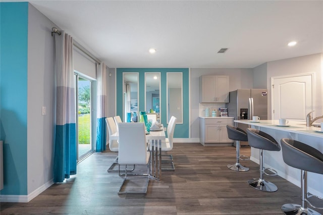 1902 Walnut Creek Dr, Kissimmee, FL 34744 - dining room featuring dark wood-type flooring and recessed lighting