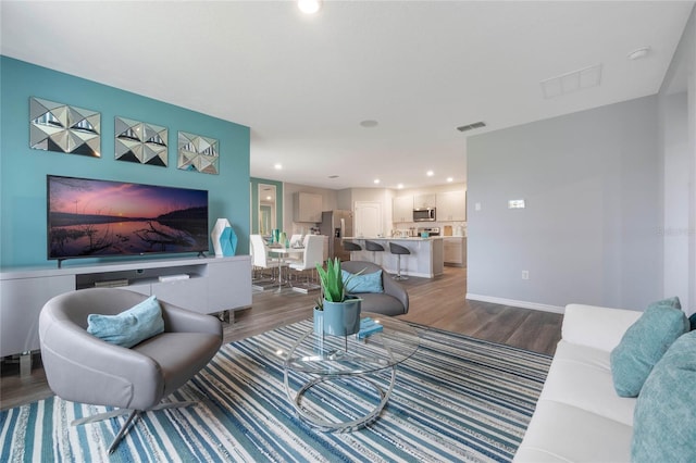 1902 Walnut Creek Dr, Kissimmee, FL 34744 - living area with dark wood-style floors and recessed lighting