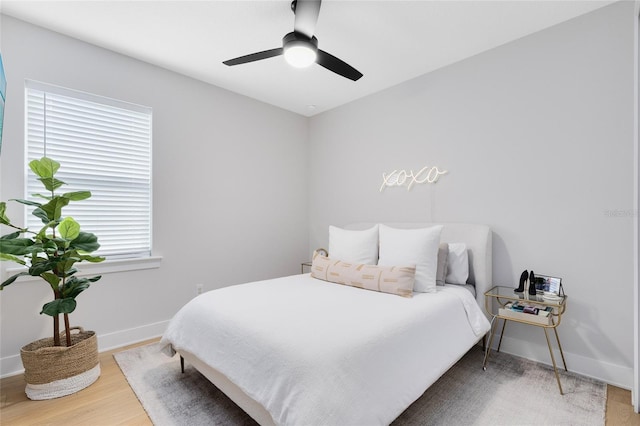 8290 Nemours Pkwy, Orlando, FL 32827 - bedroom with wood finished floors and a ceiling fan
