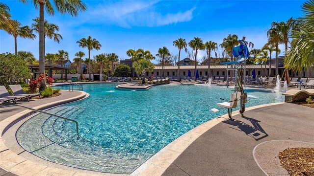 8290 Nemours Pkwy, Orlando, FL 32827 - community pool featuring a patio area