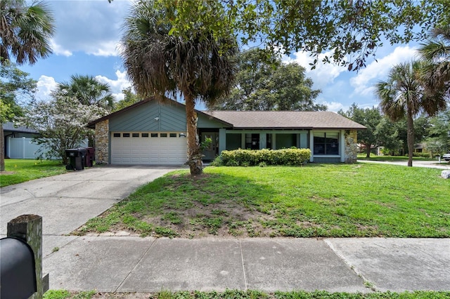 3220 Cardigan Ct, Orlando, FL 32812 - ranch-style home featuring a garage, a front yard, concrete driveway, and stone siding