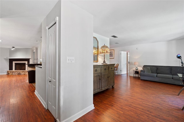 3220 Cardigan Ct, Orlando, FL 32812 - corridor featuring dark wood finished floors and baseboards