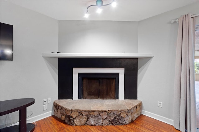 3220 Cardigan Ct, Orlando, FL 32812 - detailed view of a stone fireplace and wood finished floors