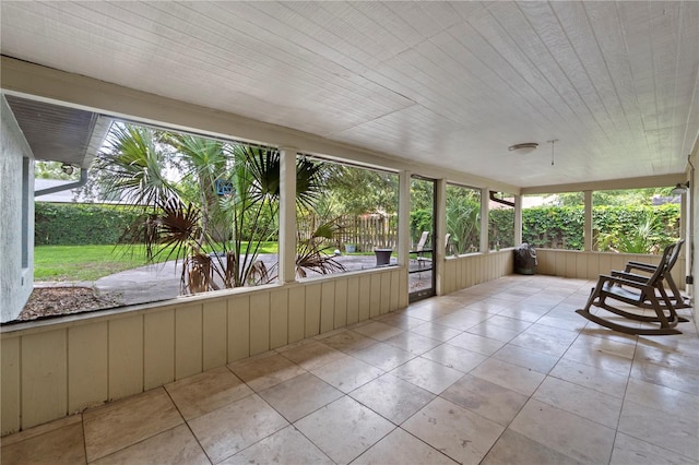 3220 Cardigan Ct, Orlando, FL 32812 - unfurnished sunroom with tile patterned floors